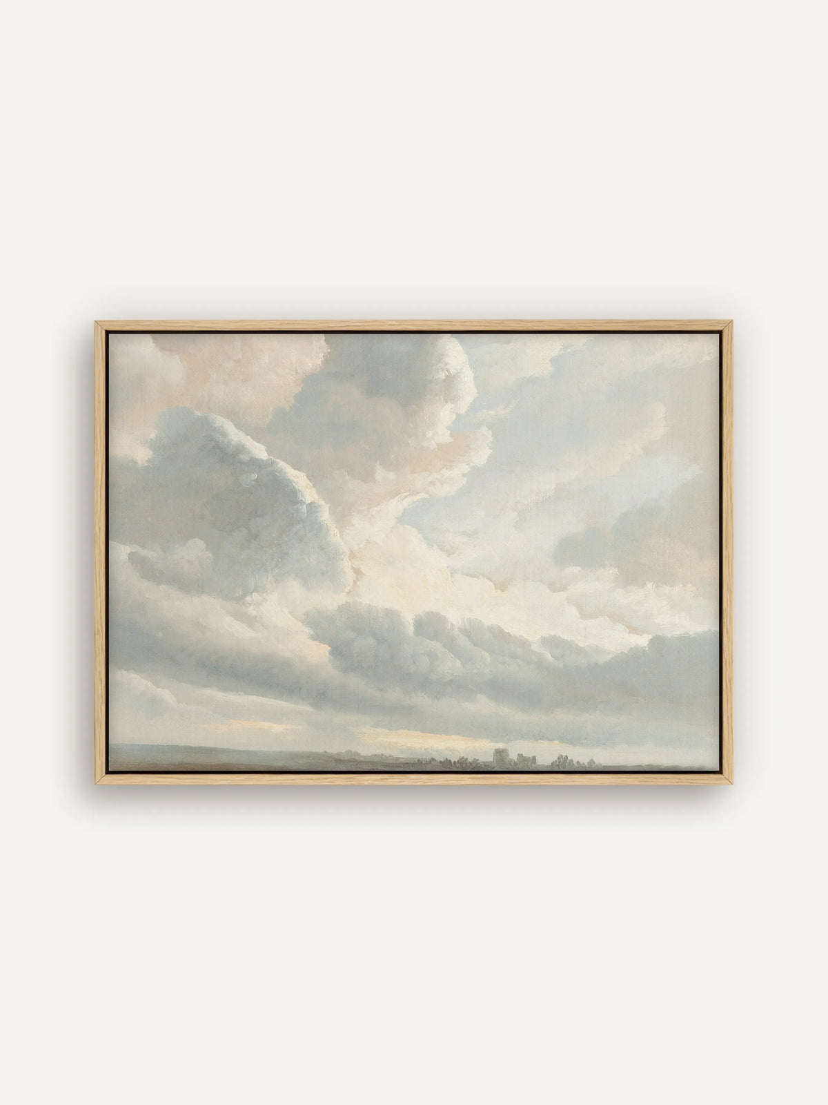 Vintage Leinwandbild im Querformat im naturfarbenen Schattenfugenrahmen. Blaugraue und cremefarbene Wolken türmen sich über einer flachen Ebene, am Horizont stehen ein Turm und Bäume als kleine Silhouetten. #Rahmen_Natur