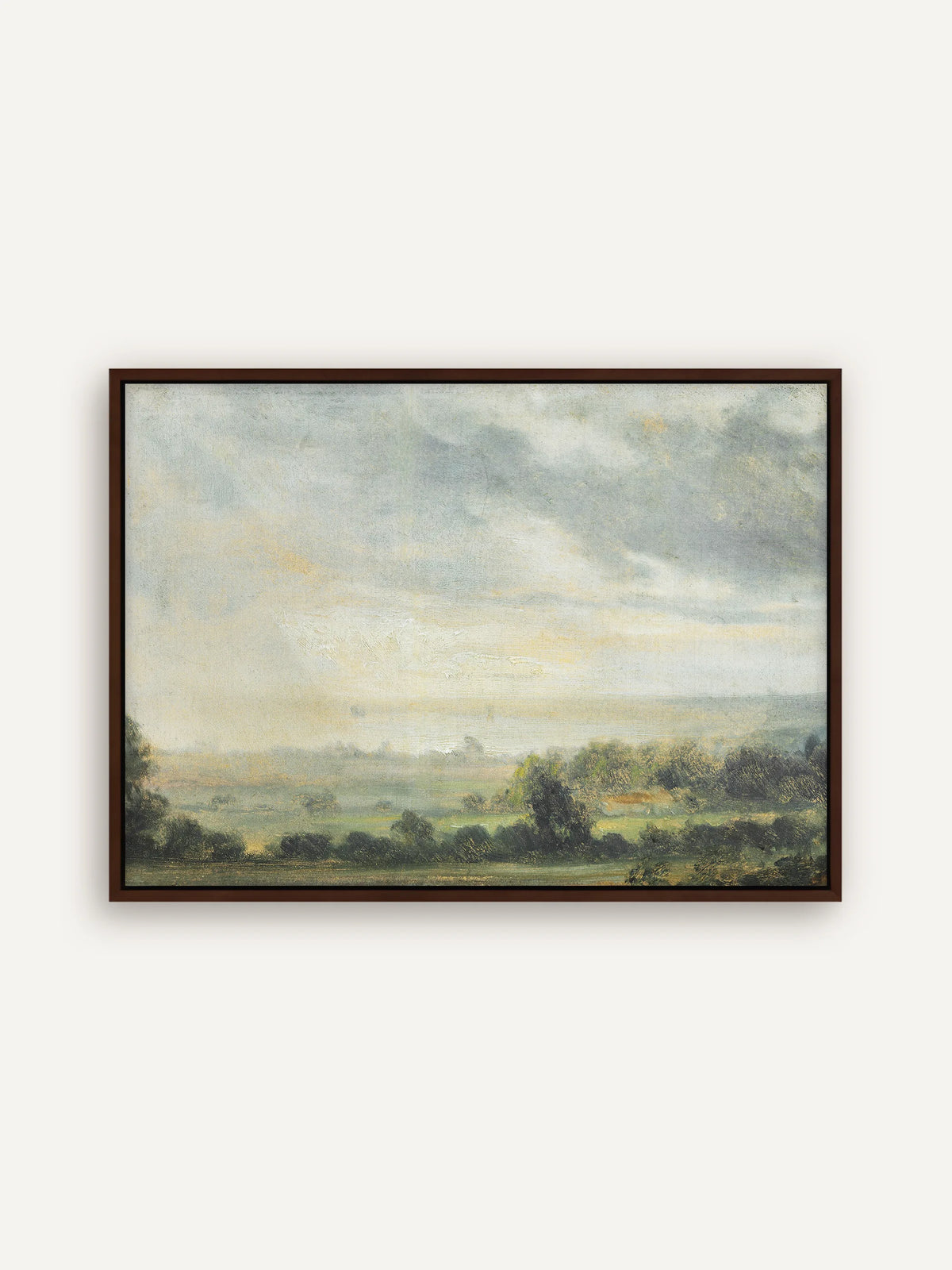 Vintage Landschaft auf Leinwand im dunkelbraunen Schattenfugenrahmen. Unter einem hohen Wolkenhimmel mit gelblichem Licht am Horizont liegen grüne Wiesen, Baumgruppen und eine dunstige Ebene. #Rahmen_Braun