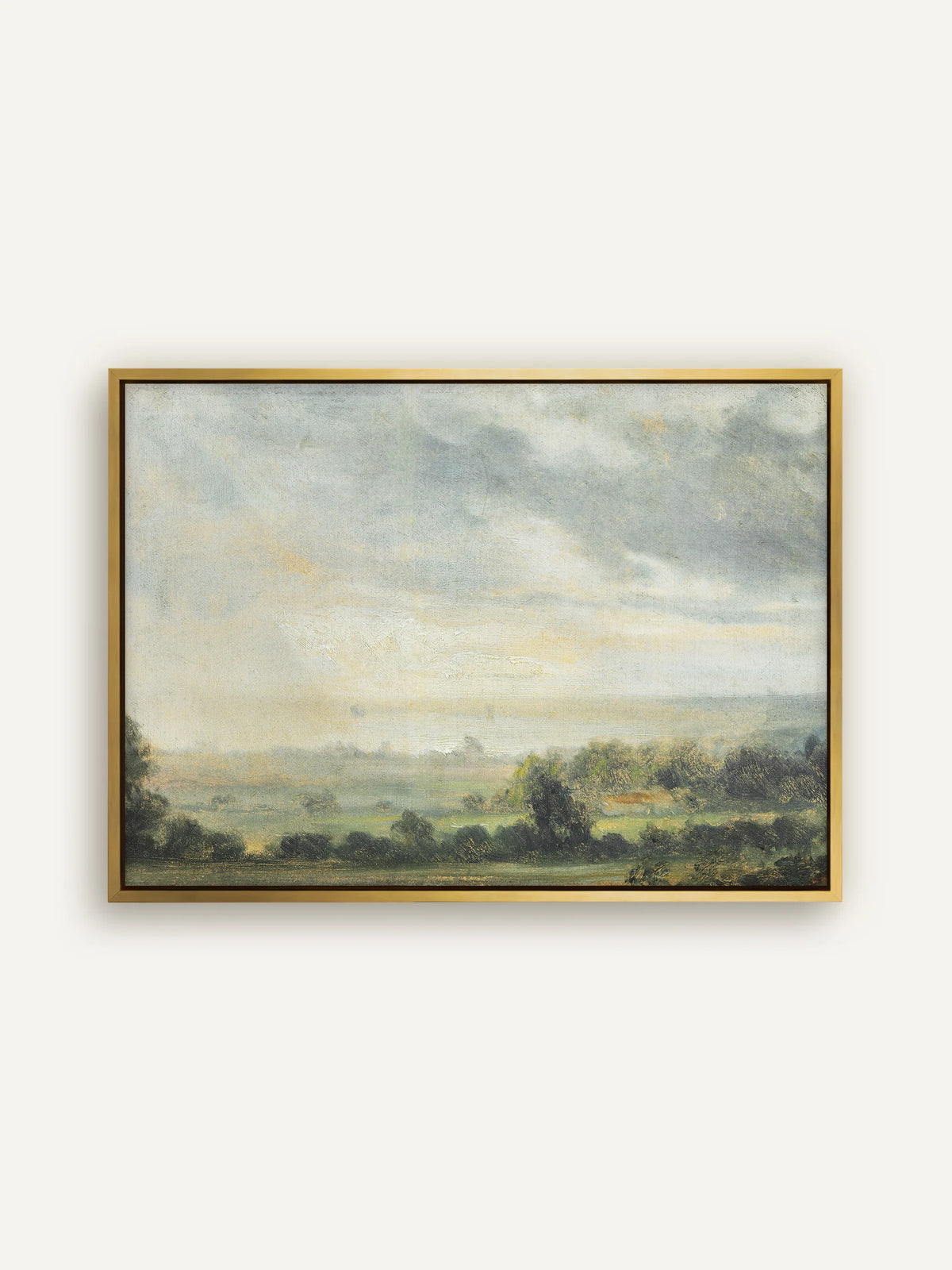Landschaft Leinwandbild im goldenen Schattenfugenrahmen. Das Gold greift das warme Licht am Horizont auf, darunter erstreckt sich ein Tal mit Wiesen und Hecken in gedeckten Grüntönen. #Rahmen_Gold