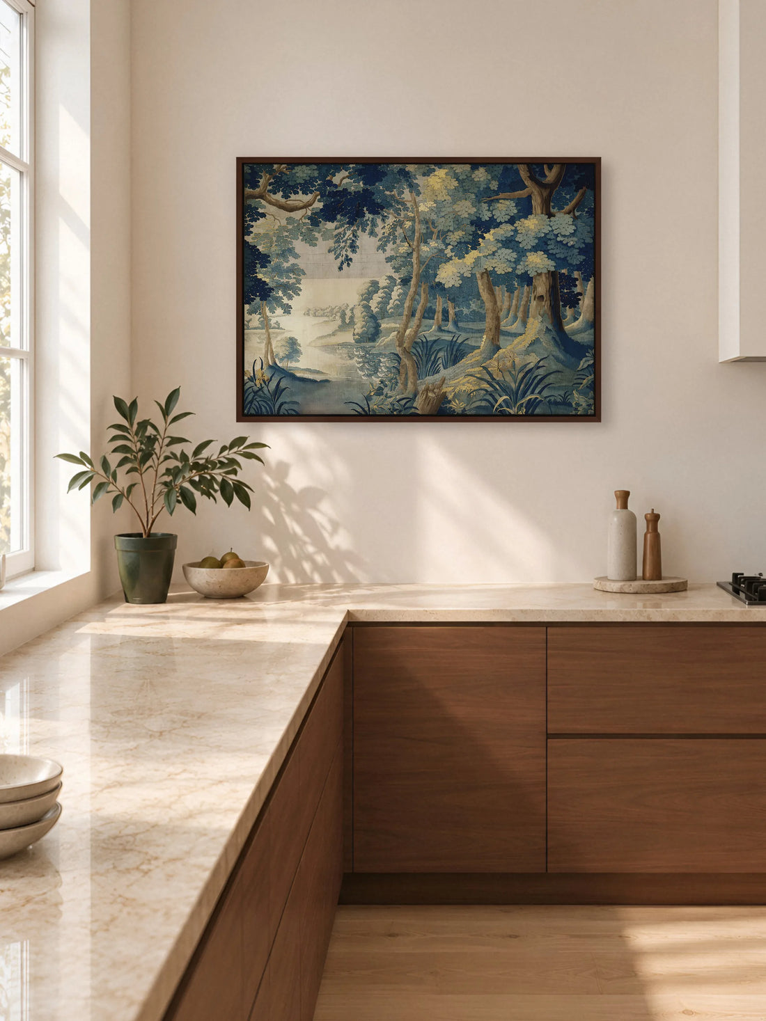 Leinwandbild mit Waldsee in Blau im braunen Rahmen in einer hellen Küche über einer Arbeitsplatte aus Marmor mit Fronten aus Nussbaum